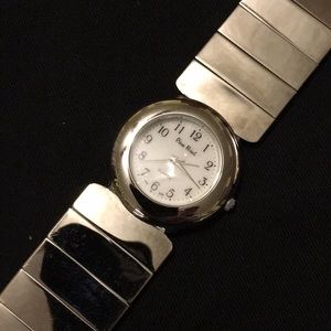 NWOT Ladies bright silver watch with shiny band.